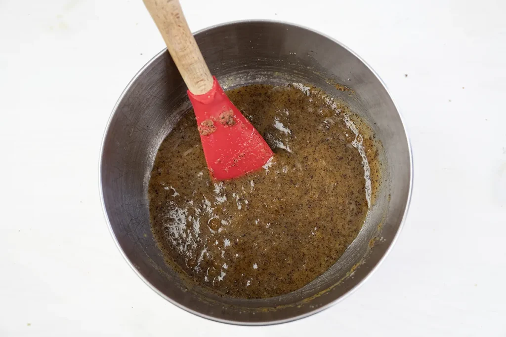 Mixing the wet ingredients for kitchen sink cookies, in a large bowl.