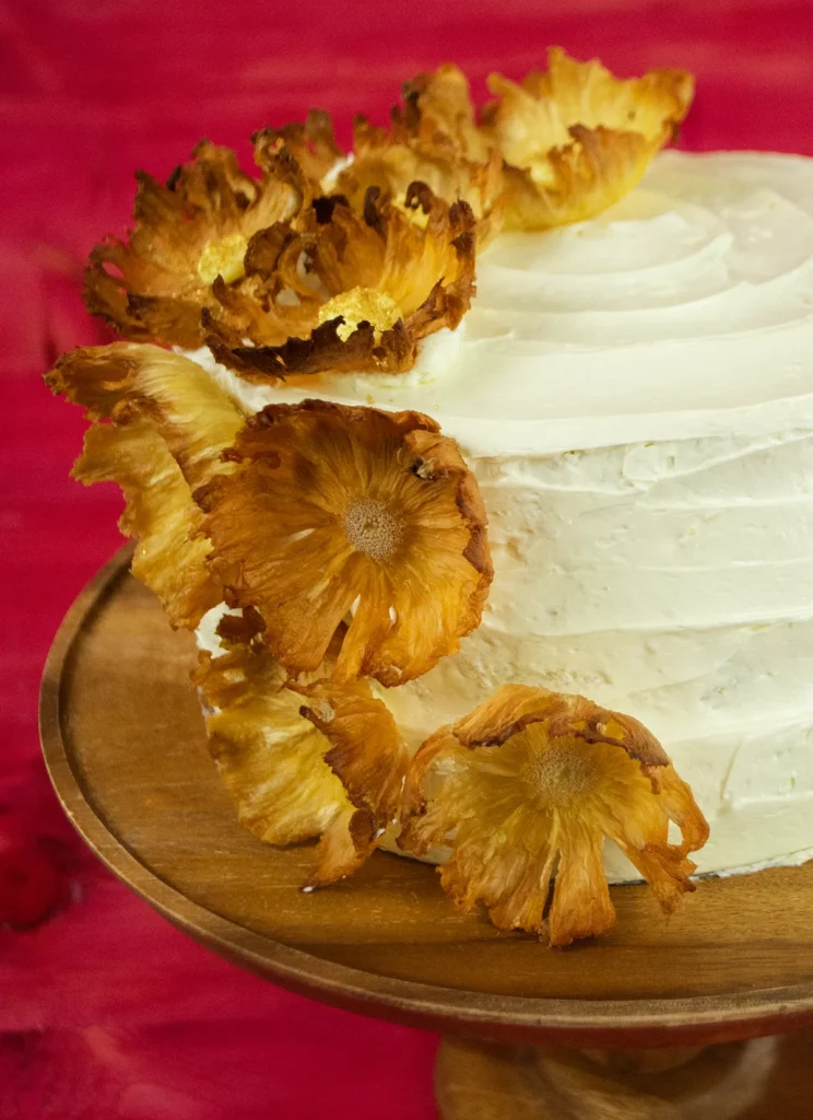 Close-up of pineapple flowers on a Pina Colada dacquoise cake.