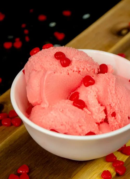 Bowl of cinnamon hearts ice cream.