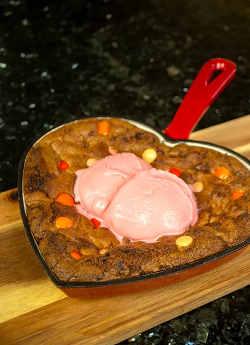 Chocolate Chip Skillet Cookie for Two, in a red heart-shaped skillet.