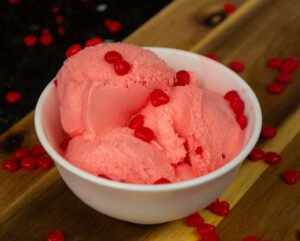 Bowl of cinnamon hearts ice cream.