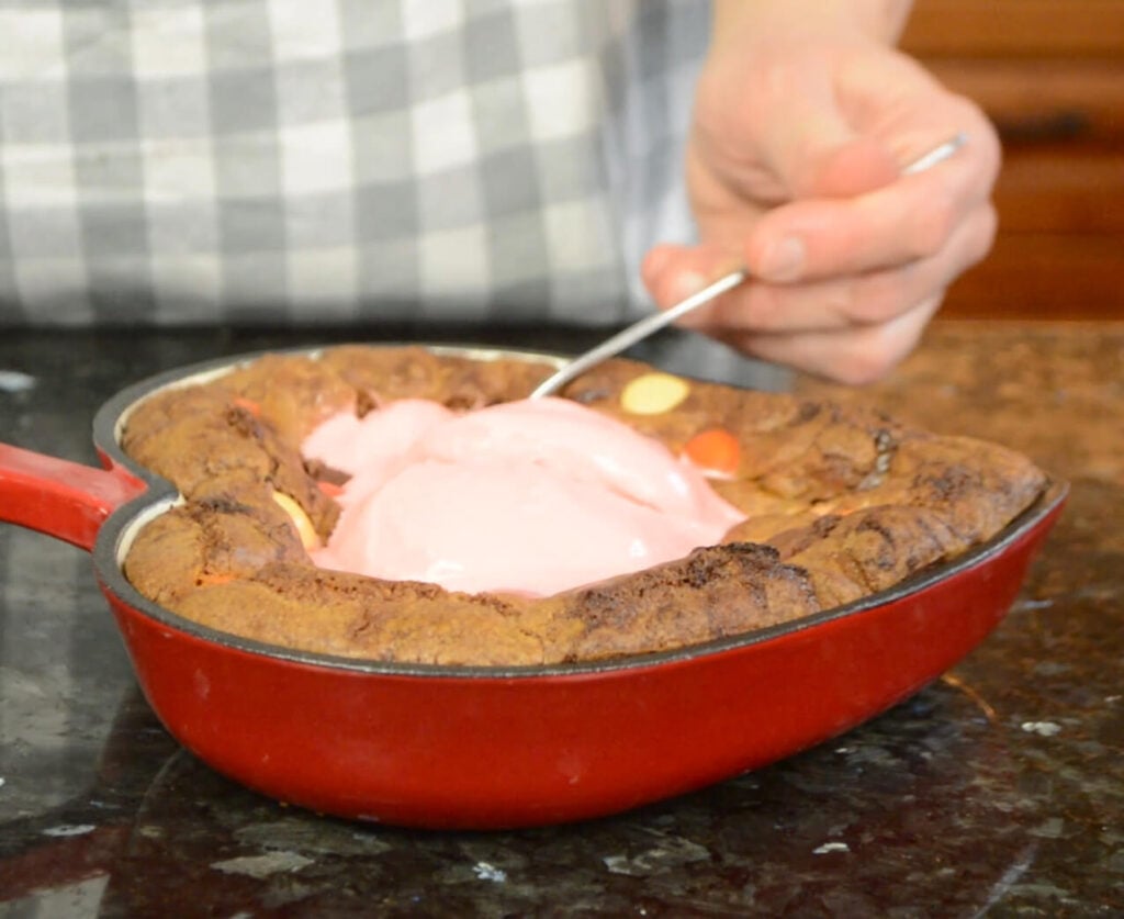 Eating a piece of Chocolate Chip Skillet Cookie.