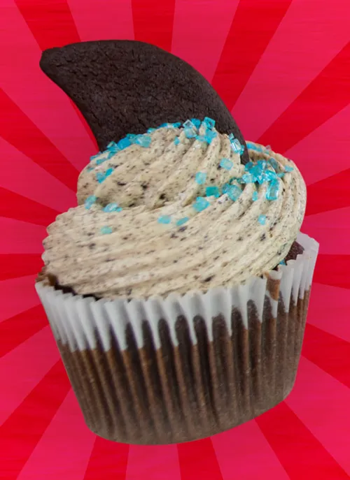 Oreo Cookies 'n' Cream cupcake with Oreo buttercream frosting, blue sprinkles, and a shark fin-shaped Oreo cookie topper.