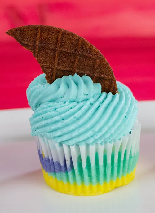 Moon Mist cupcake with a shark fin-shaped waffle cone cookie topper.