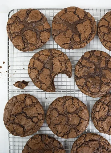 Chocolate orange brookie cookies on a cooling rack.