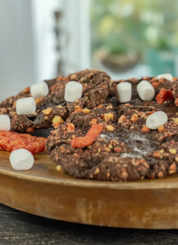 Flamin' Hot Cheetos on a wooden plate.