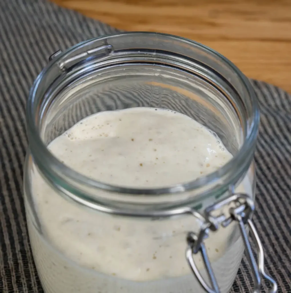 Open jar of sourdough starter.