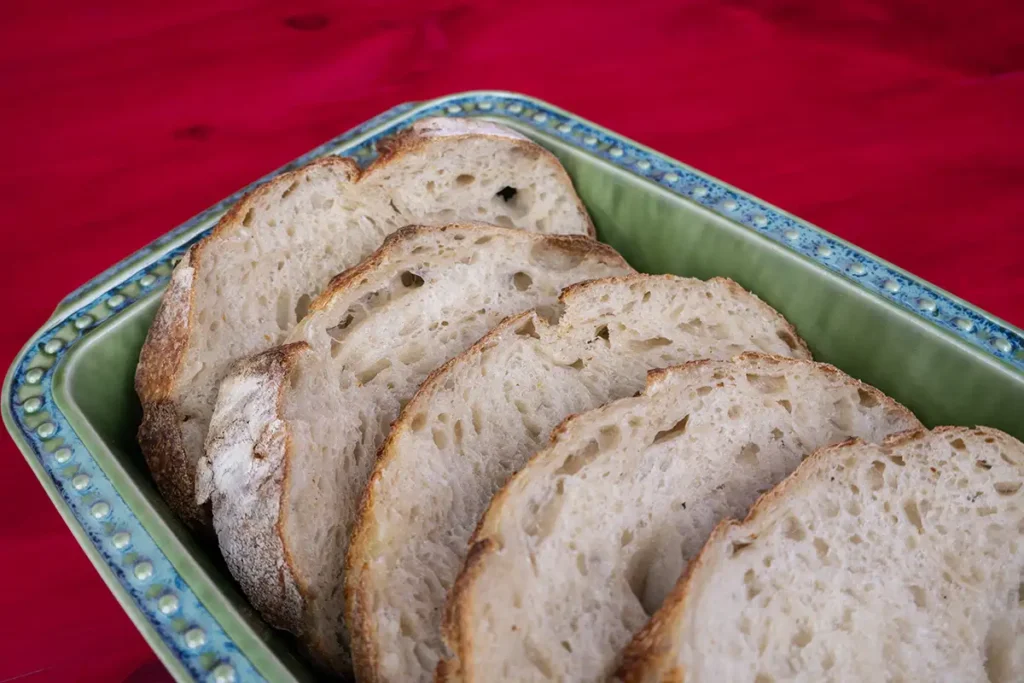 Slices of bread in a ceramic dish.