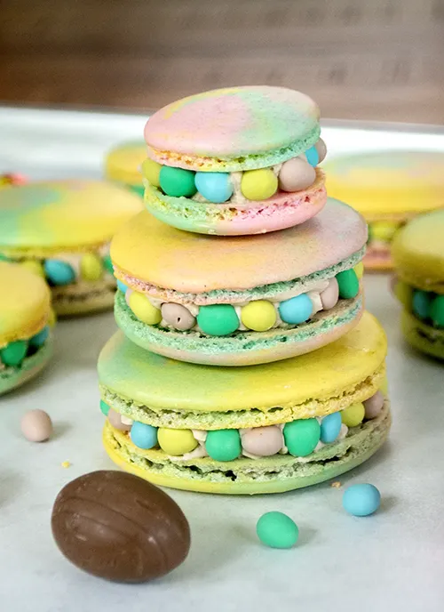 A stack of Cadbury Creme Egg macarons.