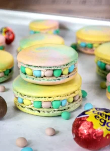 Stack of Cadbury Creme Egg macarons.