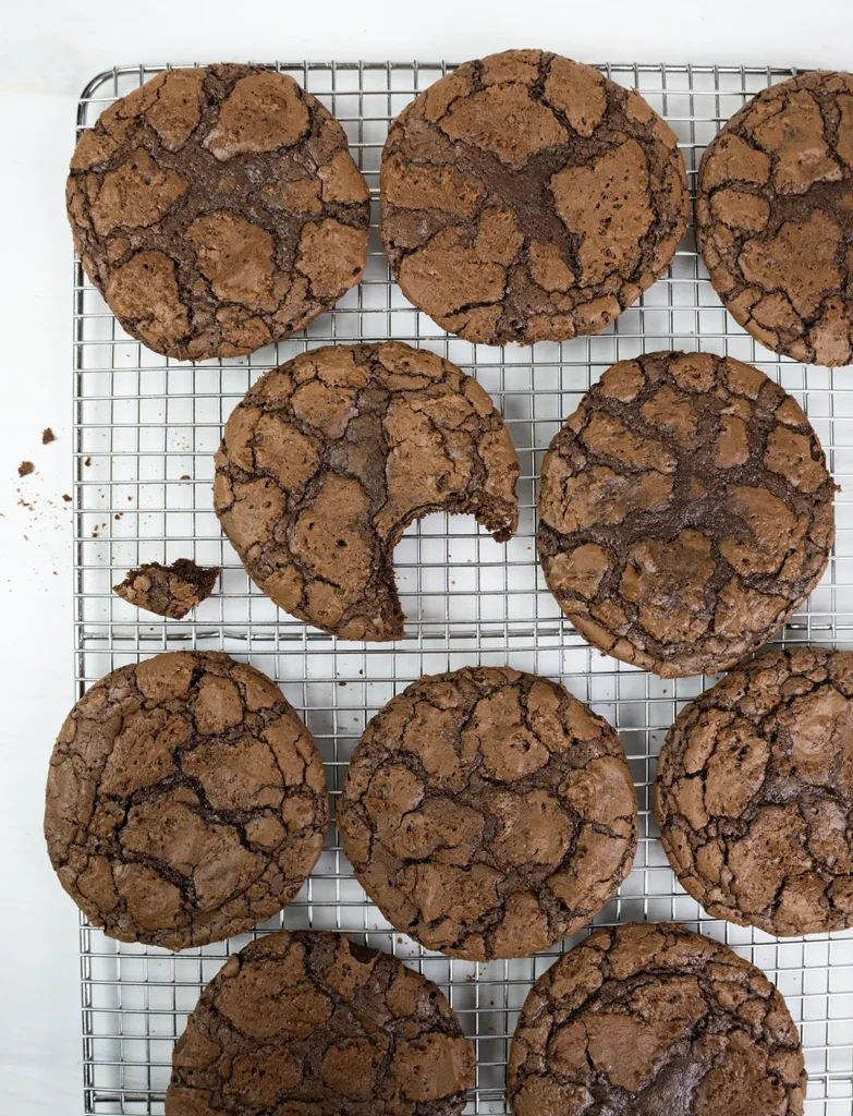 A cooling rack of chocolate orange brownie cookies.