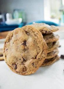 Stack of one-bowl chocolate chip cookies on a table.