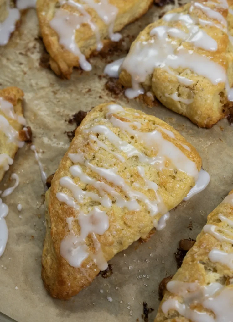 Sourdough apricot & white chocolate scones on a baking sheet.