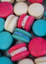 Overhead shot of a pile of colourful macarons.