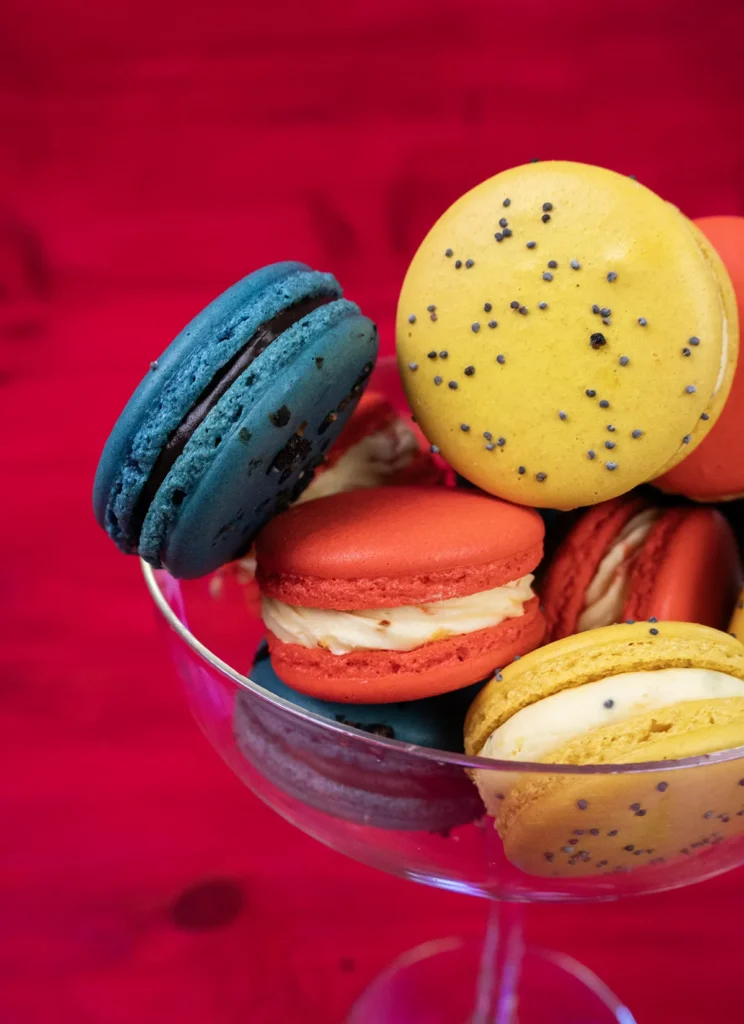 Colourful macarons in a stemmed glass.