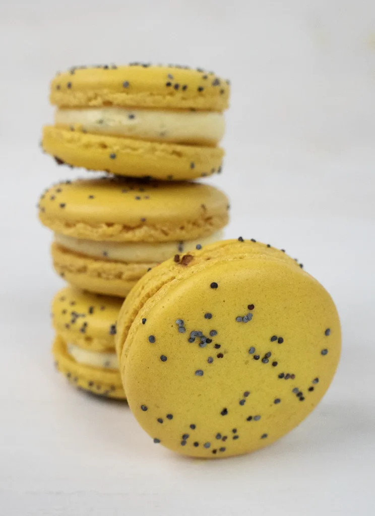 Stack of lemon poppyseed macarons.