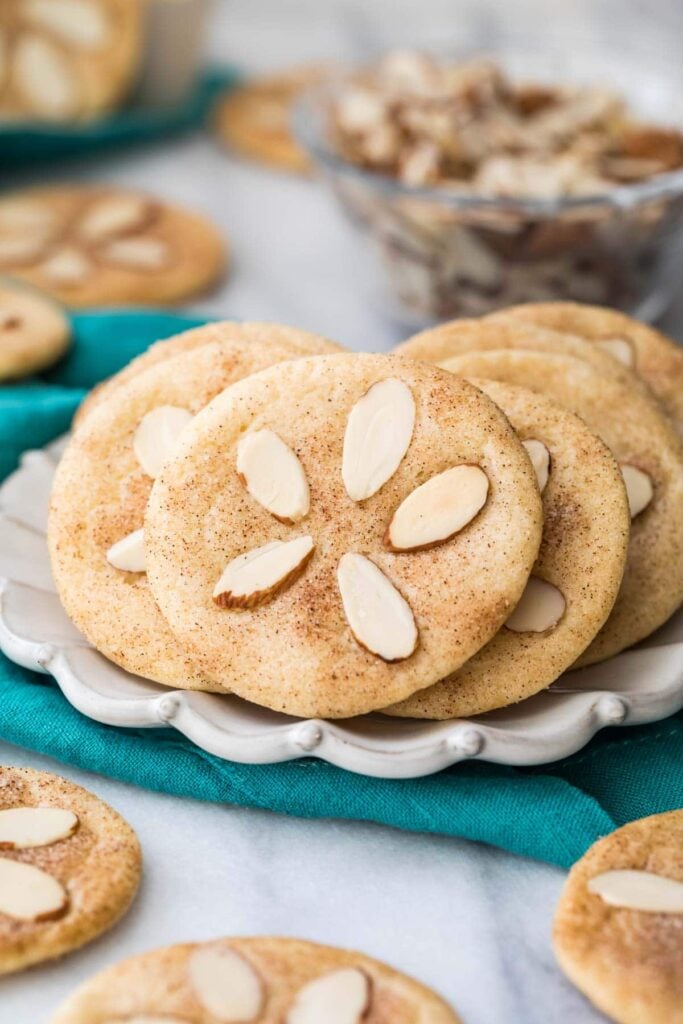 Sand dollar cookies on a plate.