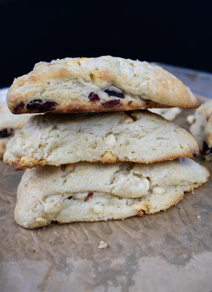 Stack of baked scones on a baking sheet.