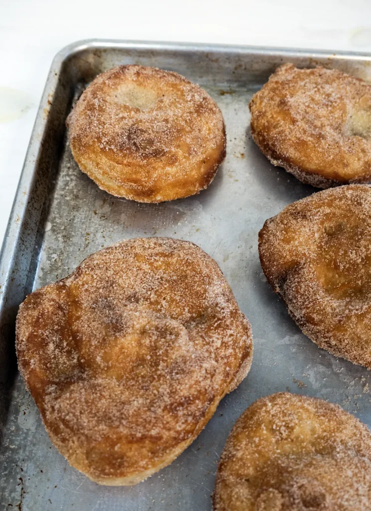 Mini sourdough Beaver Tails arranged on a baking sheet.