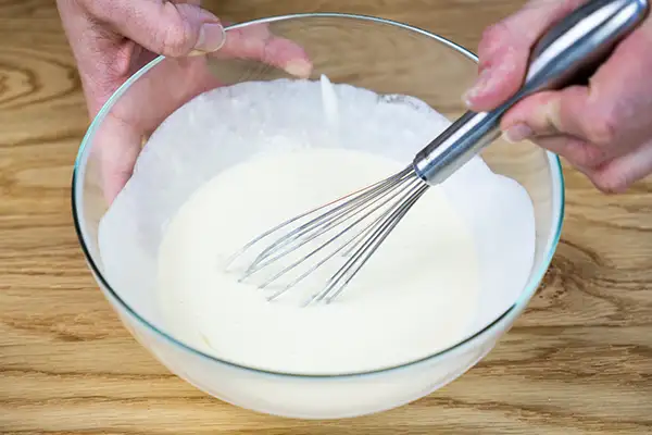 Mixing the wet ingredients for sourrdough scones.