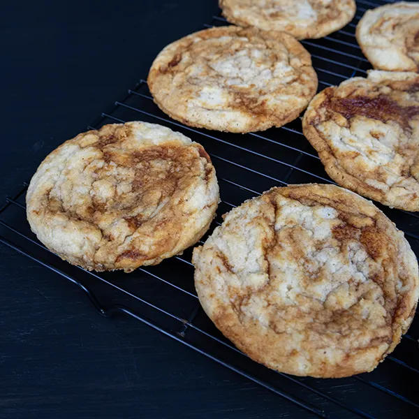Cooling sourdough gochujang caramel cookies on a wire rack.