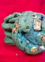 A stack of blue cookie monster cookies.
