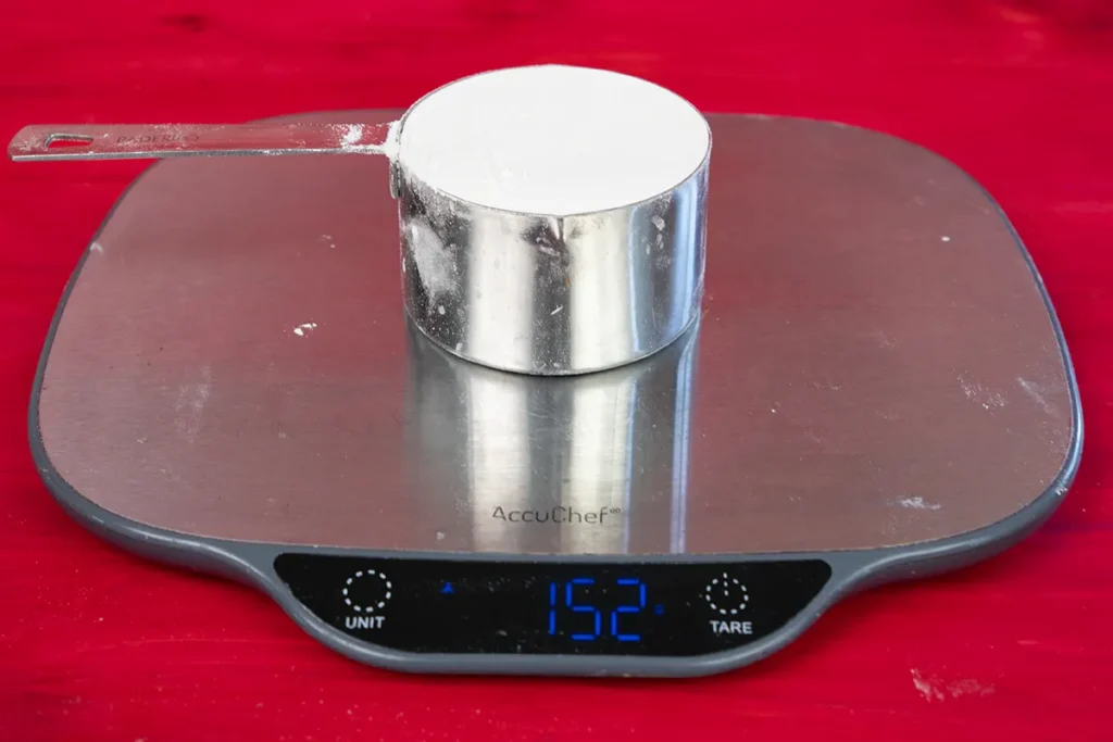 Seeing how much a cup of flour weighs.