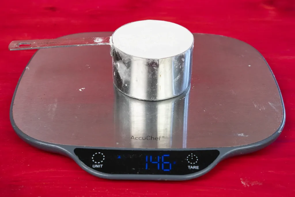 Seeing how much a cup of flour weighs.