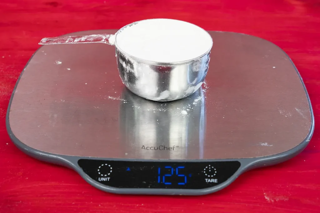 Seeing how much a cup of flour weighs.