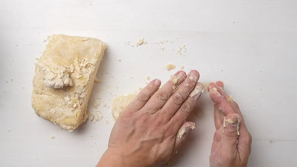 Shaping pie dough into disks after dividing it for a double crust pie.