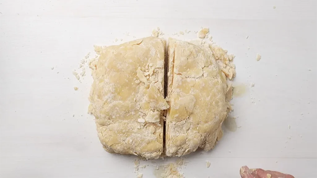 Brown butter pie dough divided for a double-crust pie.