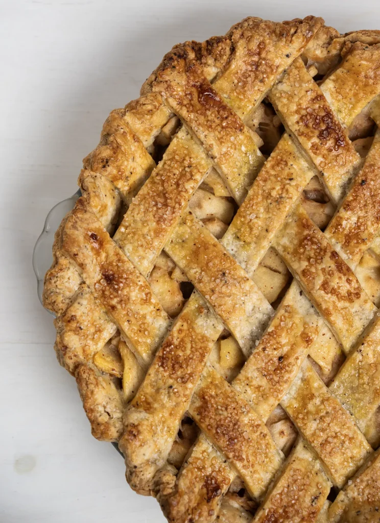 Close-up of a miso caramel apple pie with a lattice crust.
