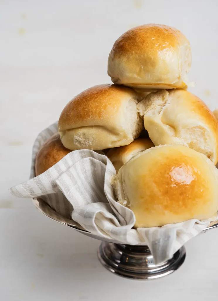 Bowl full of sourdough Hawaiian rolls.