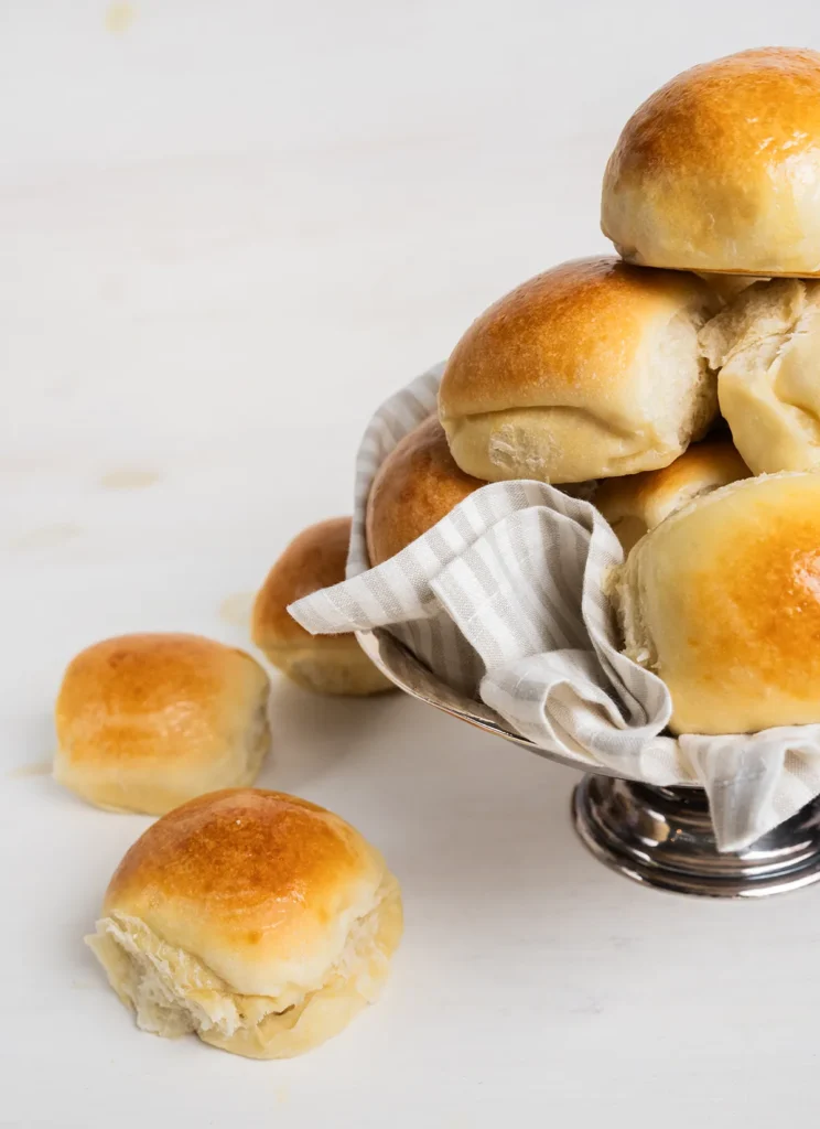 Bowl full of sourdough Hawaiian rolls.