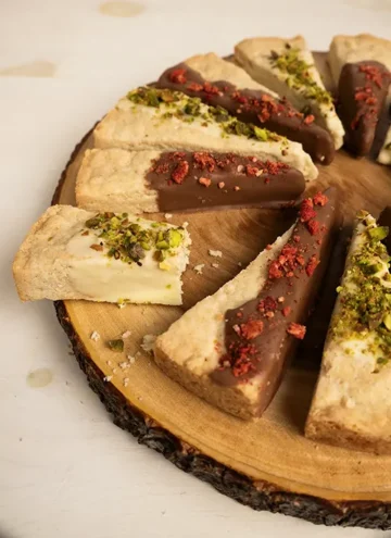Tray of classic Scottish shortbread wedges dipped in chocolate.